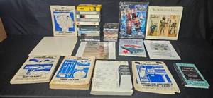 lot 337 image: Assorted Media Collection Including Manuals, CD Compilation, and VHS Tapes