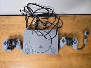 lot 400 image: Sony PlayStation 1 Console with 2 Controllers and Cables