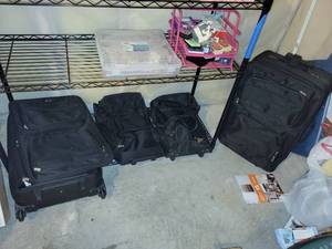 lot 409 image: Collection of Black Rolling Suitcases and Assorted Holiday Decorations