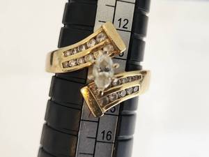 lot 18 image: 14k Gold Ring with Marquise-Cut Diamond and Accent Stones (Likely Diamonds)