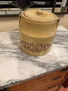 lot 55 image: Vintage Yellow Ceramic Cookie Jar with Assorted Cookie Cutters