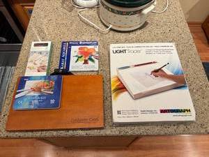lot 156 image: Artist Supply Set Colored Pencils, Watercolor Pencils, LED Light Box, and Coldwater Creek Art Kit