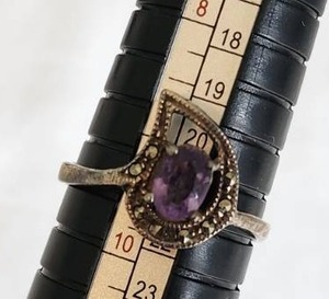 lot 175 image: Purple Gemstone Ring with Intricate Setting