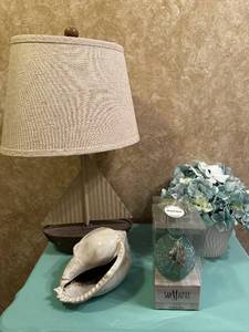 lot 119 image: Nautical Decor Set with Lamp, Sea Shell, Ocean Mist Reed Diffuser, and Faux Hydrangeas