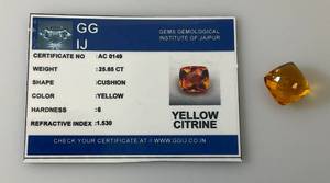 lot 41 image: GG IJ Gems Gemological Institute Of Jaipur (Lab Created) 25.65 CT Cushion Cut Blue Yellow Citrine With Card (In Protective Case)