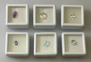 lot 44 image: Misc. (Lab Created) Gems (In Protective Sleeves) Including 1.1Ct Pink Amethyst, 1.14 CT Blue Zircon, 1.17 Ct. Sky Blue Topaz, 1.5 CT White Topaz, 2.09 CT Blue Kyadite & More