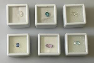 lot 48 image: Misc. (Lab Created) Gems (In Protective Sleeves) Including 1.1Ct Pink Amethyst, 1.14 CT Blue Zircon, 1.17 Ct. Sky Blue Topaz, 1.5 CT White Topaz, 2.09 CT Blue Kyadite & More