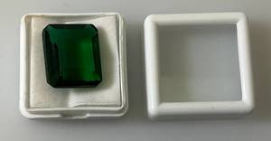 lot 52 image: 18.50 CT (Lab Created) Emerald Cut Green Moldavite (In Protective Sleeve)