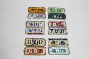lot 25 image: Collection of 12 Vintage License Plates from Various States