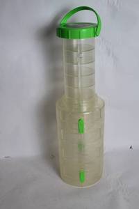 lot 254 image: Transparent Plastic Container with Green Lid and Handle