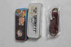 lot 281 image: Vintage Fossil Collectible Tin Set with Leather Keychain
