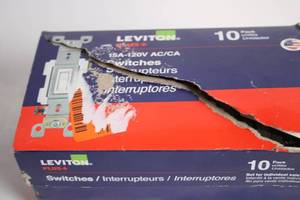 lot 152 image: Leviton 15A-120V White Light Switches 10 Pack - Damaged Box