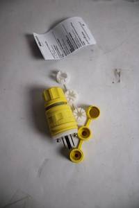 lot 228 image: Yellow Twist Lock Plug with Accessories