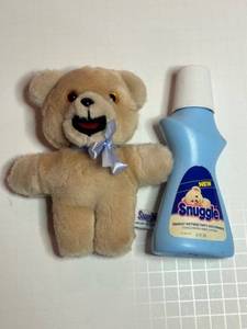 lot 83 image: Snuggle Fabric Softener Bottle and Stuffed SNUGGLE Bear Toy