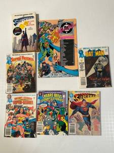 lot 335 image: Collection of 7 Vintage DC Superhero Comics & Books - Superman, Batman, and More