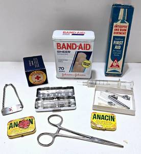 lot 204 image: Vintage First Aid Kit Collection with Bandages, Glass Syringes and Other Instruments