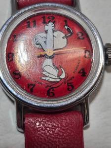 lot 11 image: 1958 Peanuts Snoopy Childrens Watch with Red Leather Strap