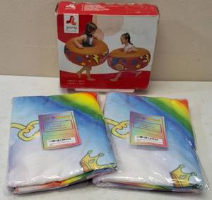 lot 25 image: Jackhammer Bumpers & (2) Unicorn Kids Bath & Beach Towel