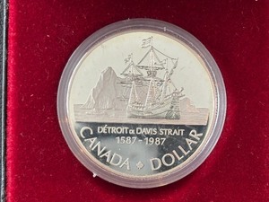 lot 21 image: 1987 Canada Silver Dollar Detroit De Davis Strait
