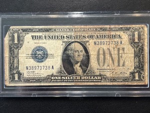 lot 105 image: 1928 A Blue Seal $1 Dollar Funnyback Silver Certificate