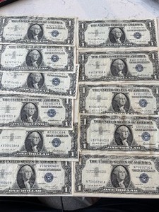 lot 154 image: 1957 Blue Seal $1 Dollar Silver Certificates