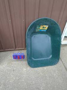 lot 102 image: New Yard Rover Poly wheel barrow tub. As shown.