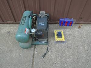 Hitachi dual tank air compressor. Has broken outlet port nut replacement pressure switch included. As shown.