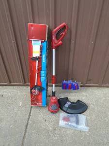 lot 107 image: Craftsman 110 volt weed trimmer. Appears new. As shown.