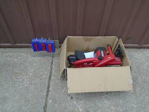 lot 128 image: Craftsman 110 volt chainsaw for parts or repair. Does power up. As shown.