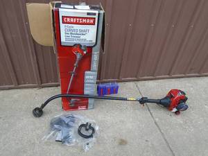 lot 131 image: Craftsman 2 cycle curved shaft trimmer. Looks lightly used. As shown.