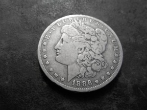 lot 14 image: 1886 O Silver Morgan Dollar