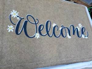 lot 41 image: Welcome Floor Mat- backing has flaw...