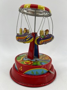 lot 10 image: Schylling Rocket Ride Spinning Carousel Tin Lithograph Toy
