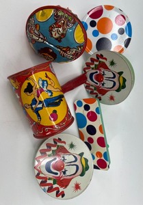 lot 22 image: Vintage Tin Clown and Polka Dot Noise Makers Set