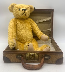 lot 53 image: Vintage Jointed Teddy Bear with Wicker Suitcase by Jennys Teddy