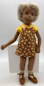 lot 83 image: Vintage Sasha Doll with Yellow Floral Dress and Shoes