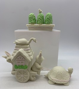 lot 92 image: Department 56 Snowbunnies Springtime Stories Shrubs-in-a-Tub and Slow-Moving Vehicle Set
