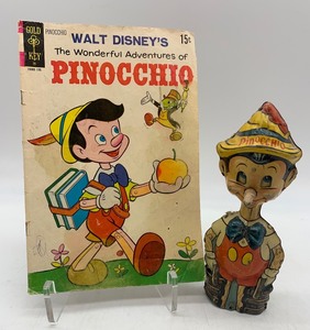 lot 132 image: Vintage Disney Pinocchio Comic Book and 1939 Wind-Up Pinocchio Toy