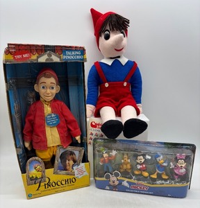 lot 145 image: Cuddle Toys Pinocchio Plush, Talking Pinocchio Doll, and Disney Collectible Friends Set