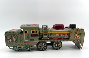 lot 151 image: Vintage Tin Litho Toy Train with Archer and Horse Graphics