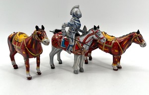 lot 165 image: Vintage Mikuni Tinplate Toy Knight and Three Horses Set