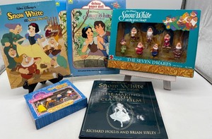 lot 232 image: Disney Snow White Collectible Set - Books, Paper Doll, Magnets, and Figurines