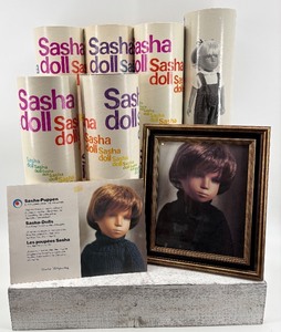 lot 301 image: Collection of Sasha Dolls Packaging with Framed Portrait