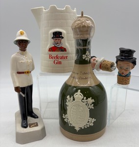 lot 307 image: Collection of Ceramic Beefeater Gin Jug and Royal Doulton Figurines
