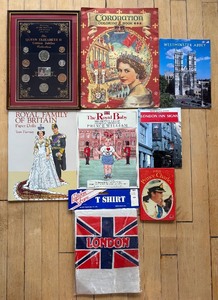 lot 314 image: Collection of British Royalty Memorabilia Featuring Coins, Books, and T-Shirt