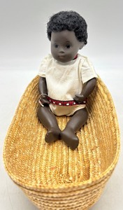 lot 387 image: Vintage Sasha African American Baby Doll in Basket