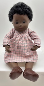 lot 388 image: Vintage Sasha African American Porcelain Baby Doll in Pink Plaid Dress