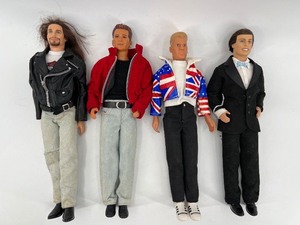 lot 401 image: Collection of 4 Vintage Ken Dolls with Varied Outfits including Harley Davidson