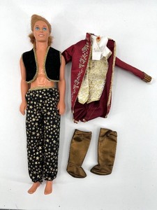 lot 404 image: Vintage Ken Doll with Star-Patterned Pants and Accessories