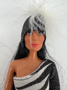 lot 406 image: Vintage Cher Barbie Doll in Striking Outfit with Feathered Headpiece